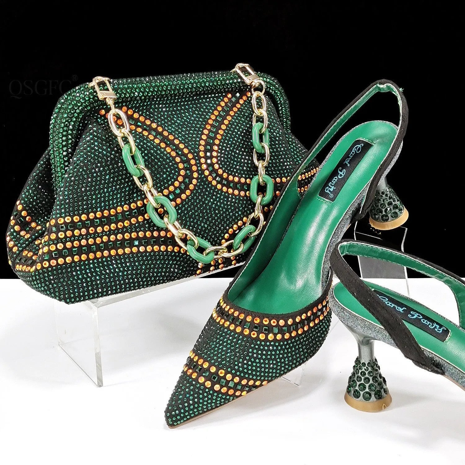 Women's pink pointed toe high heel shoes with rhinestones and a matching small clutch bag.
