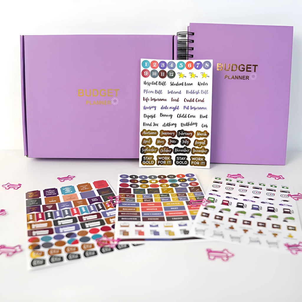 J12 purple coil-bound financial planning notebook with budget stickers and paper clips