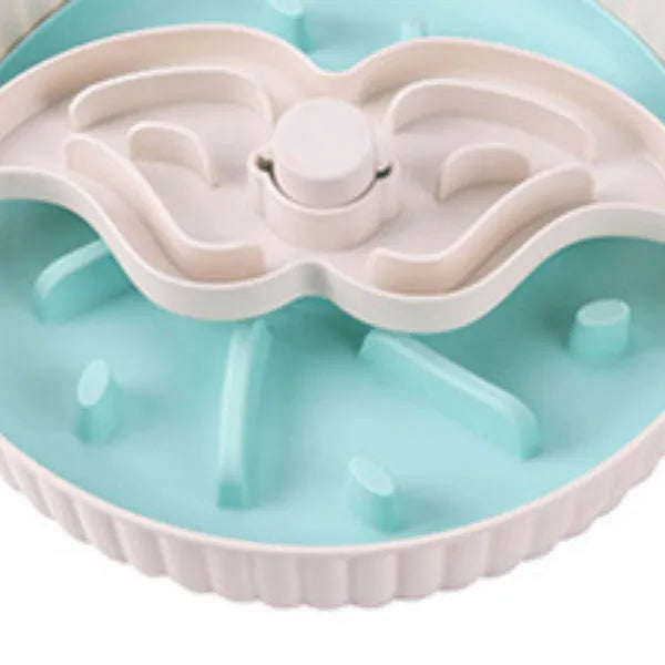 Grey plastic pet bowl with rotating windmill-pattern slow feeder licking mat inside