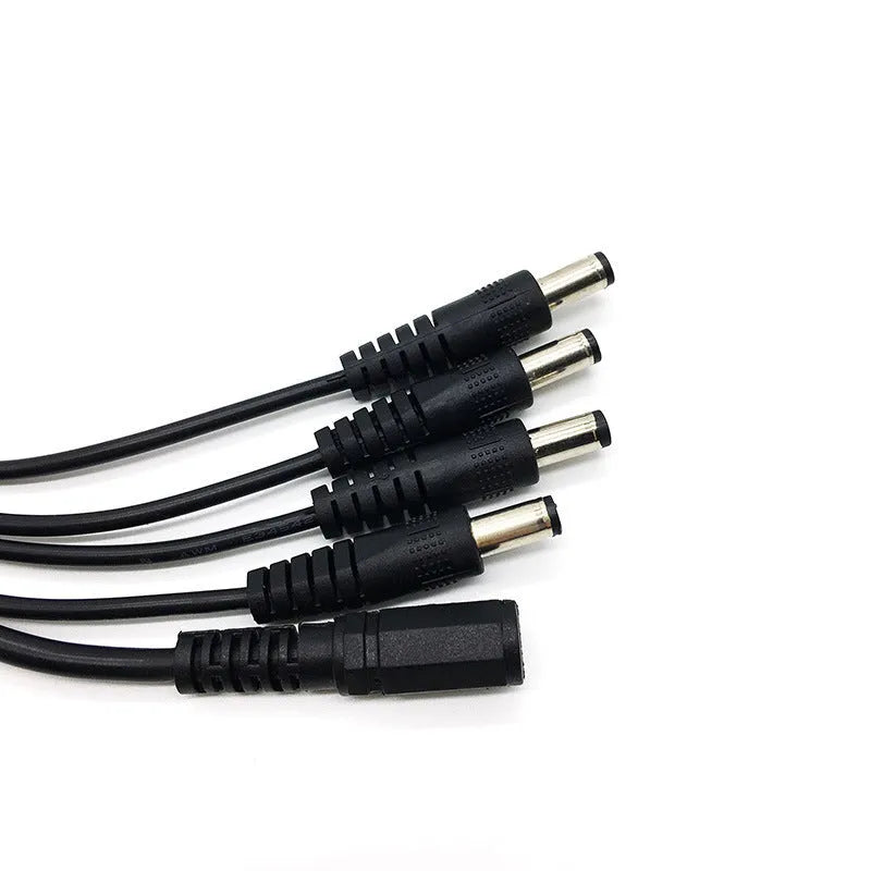 Black 12V DC 1-to-4 power splitter cable with five 5.5mm connectors for monitoring systems