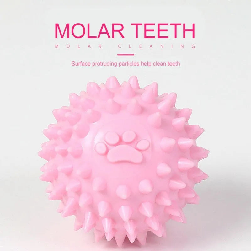 Blue, pink, or yellow TPR dog chewing ball with textured sides for tooth cleaning