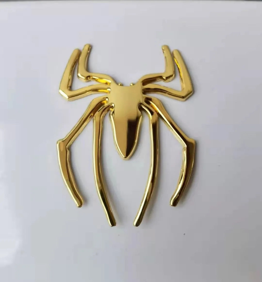 Three-dimensional metal spider bumper sticker in zinc alloy, showing detailed design