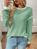Women's loose round neck long sleeve polyester pullover top shown in one of seven available colours.