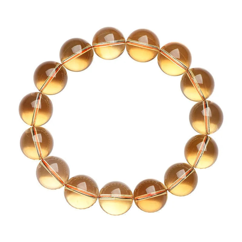 Natural citrine scattered beads ball bracelet showing polished gemstone beads on a wrist.