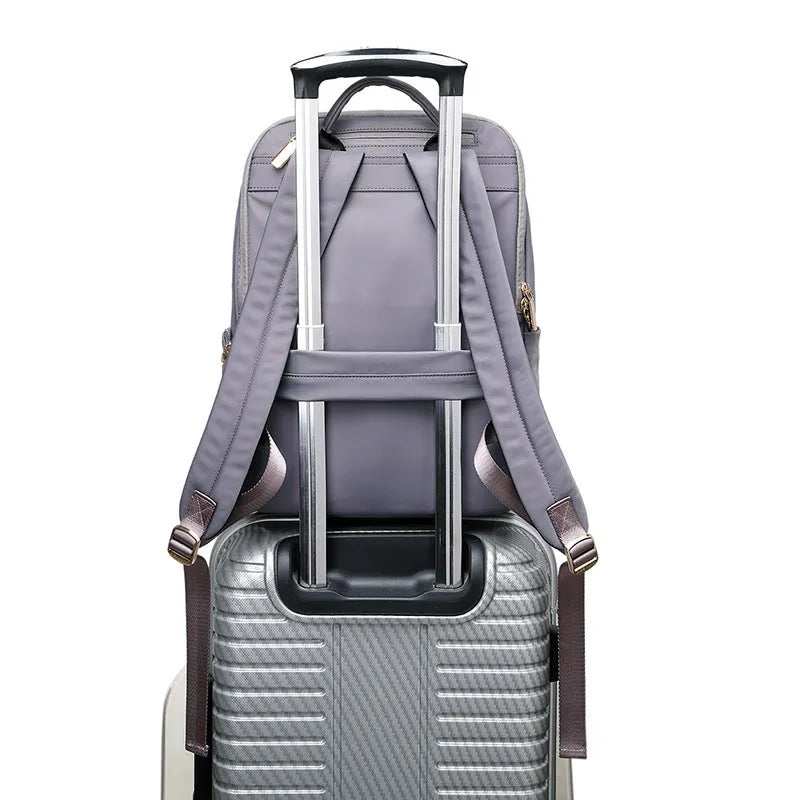 Oxford cloth women's backpack with mesh back panel and adjustable straps in black or purplish grey