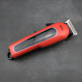 Professional digital hair clipper in black, red, or white with 4 limiting combs, charger, and cleaning tools.