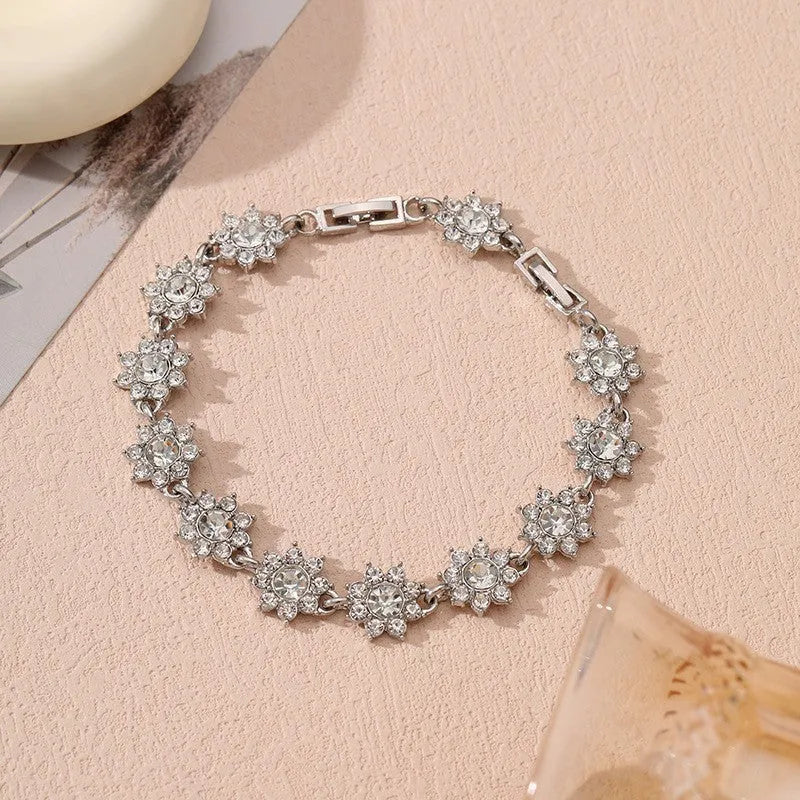 Zinc alloy flower bracelet with electroplated colour finish and colourful crystal decorations in gold and silver variations