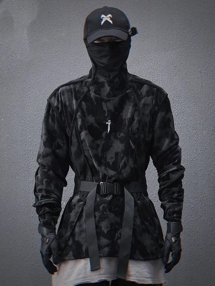 Man wearing a black tie dye printed turtleneck sweater with loose fit and drop shoulders.