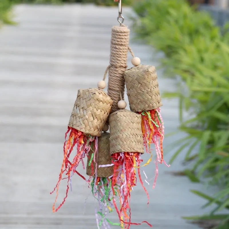 Wood and sisal parrot toy with colourful shredded paper filling, size 15 by 35 centimetres