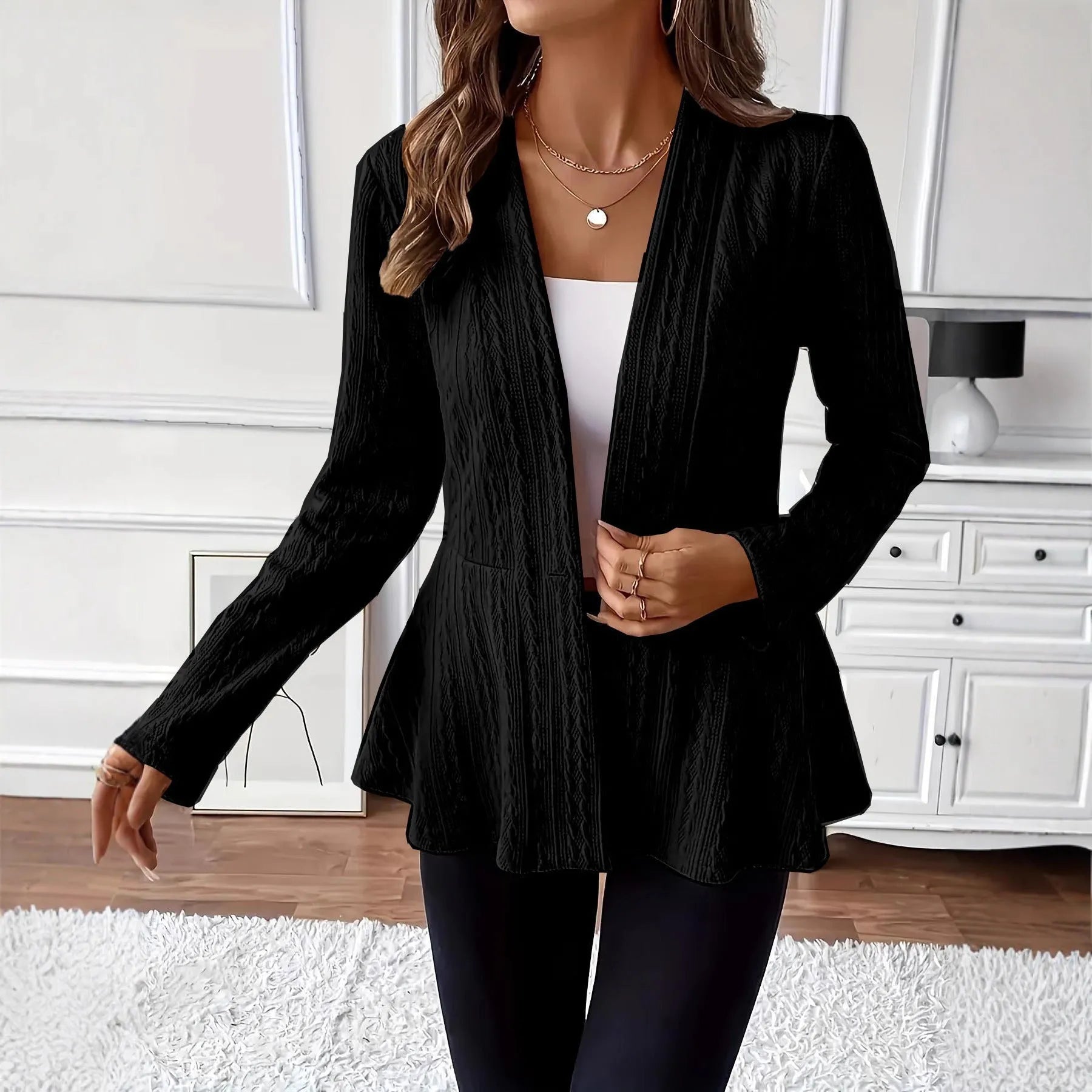 Women's apricot tight-fit Jacquard knitted cardigan with one button on a hanger.