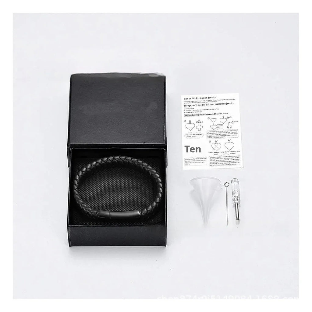 Black stainless steel and leather cinerary bracelet with engraved text, presented in a gift box.
