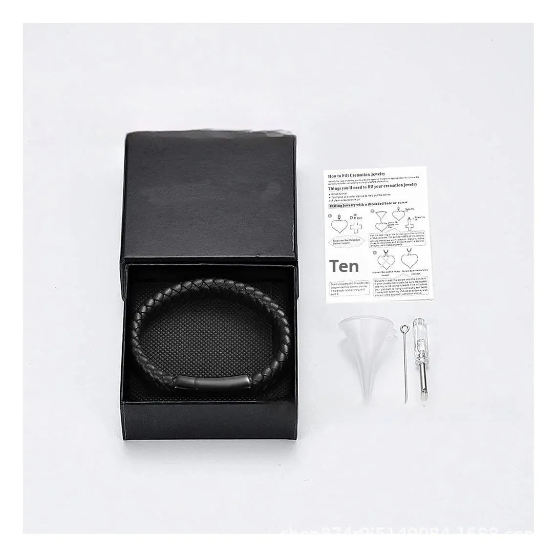 Black stainless steel and leather cinerary bracelet with engraved text, presented in a gift box.