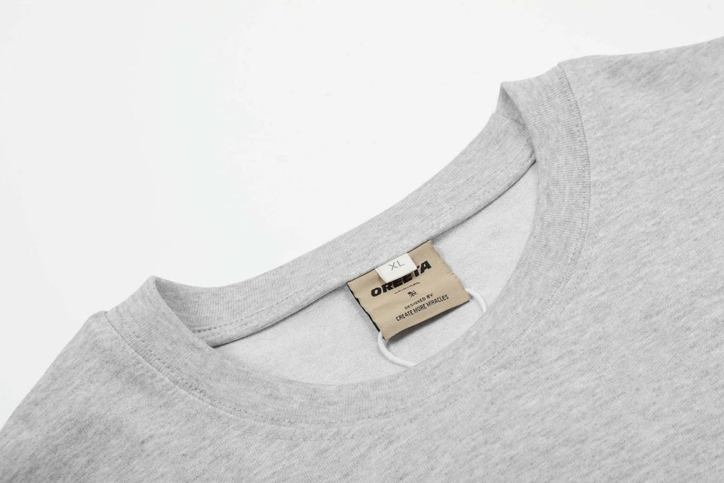 Men's loose fit cotton pullover top in American retro style showing black and flower grey colour options