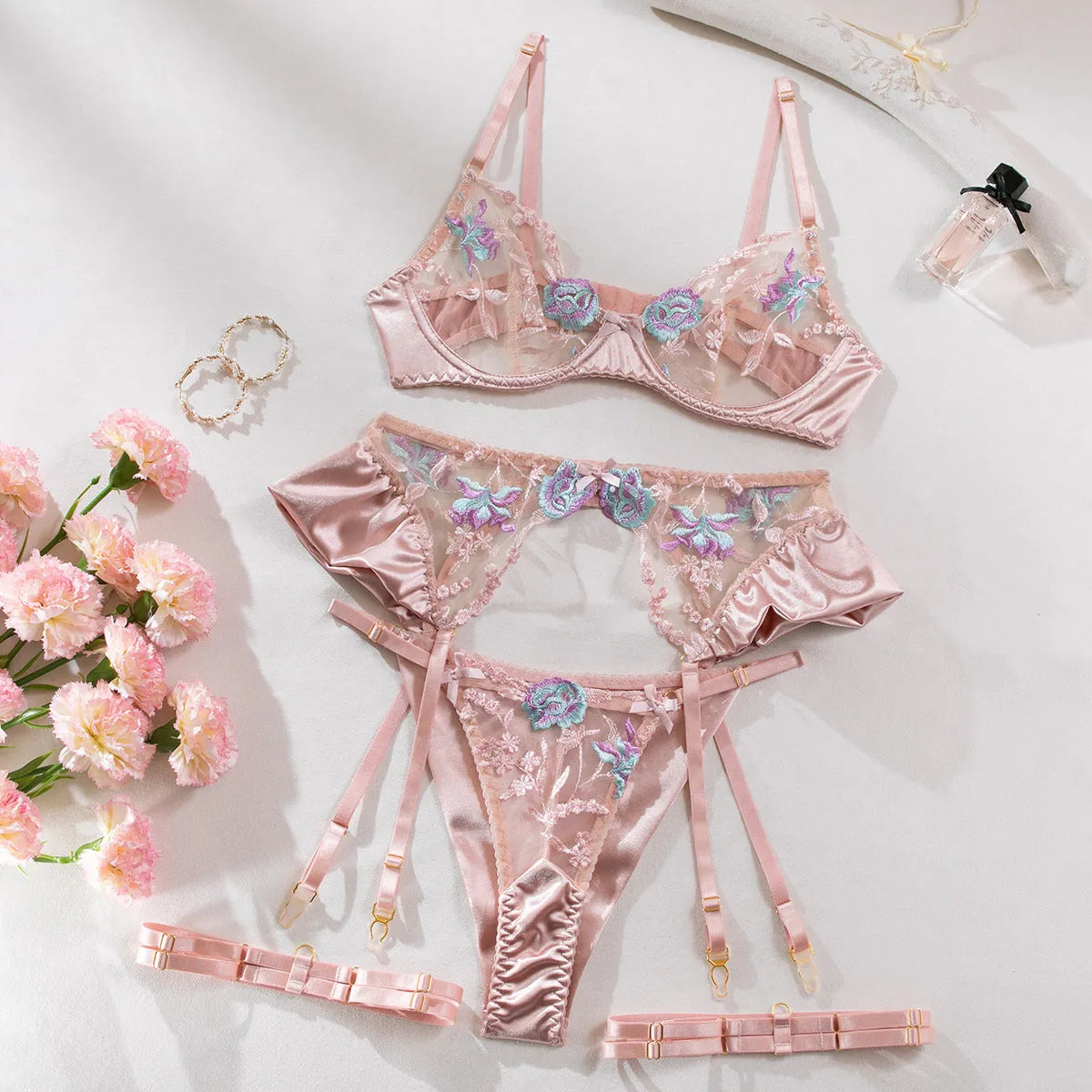Light purple satin lingerie four-piece set with mercerized embroidery detailing, shown in both colour options