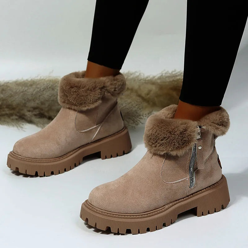 Women's black high-top snow boots with side zipper and thick plush lining on a winter background.