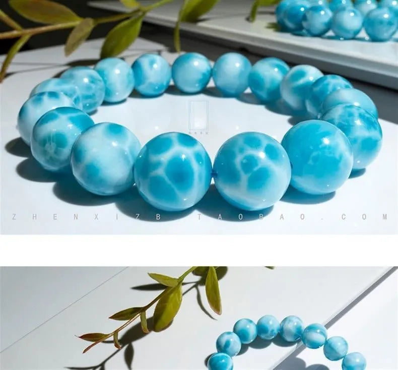 Blue Bodhi bracelet with sea-pattern crystal beads and pearl accents in Maillard style on wrist
