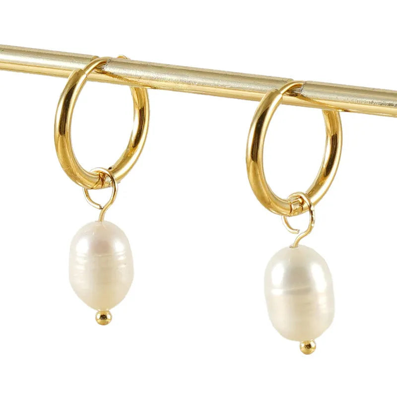 Gold geometric pearl earrings for women made from stainless steel with electroplated finish.