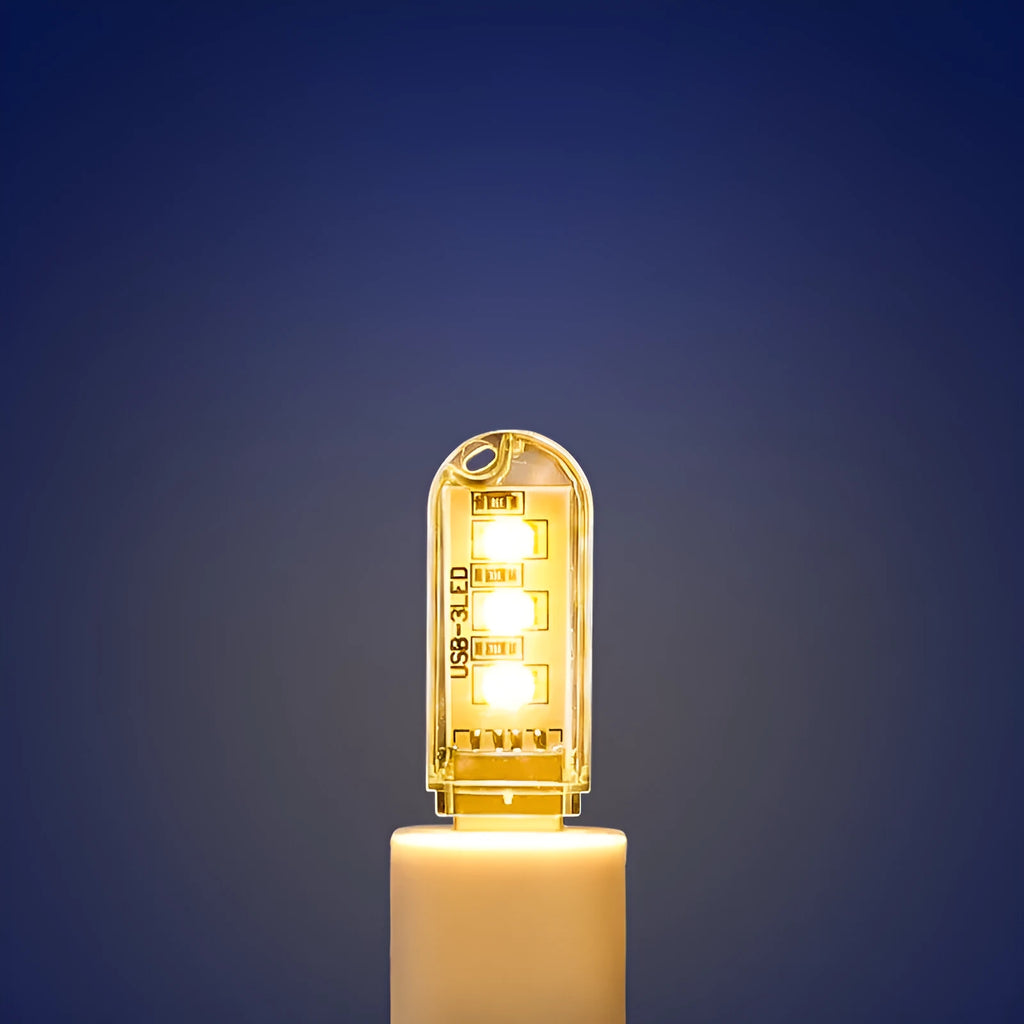 Small white LED baby night light with USB cable showing white and warm light settings