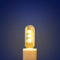 Small white LED baby night light with USB cable showing white and warm light settings