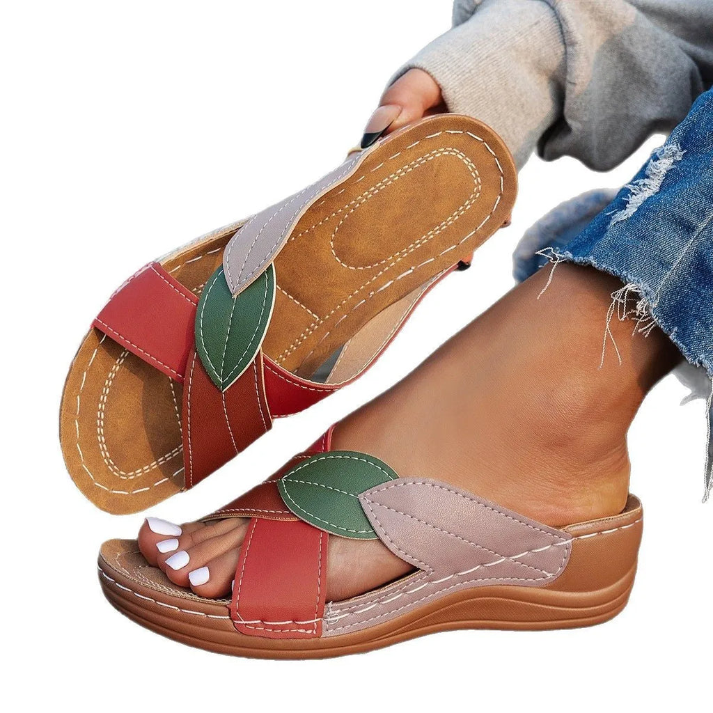 Women's black thick-soled slippers with cross-straps and a peep-toe