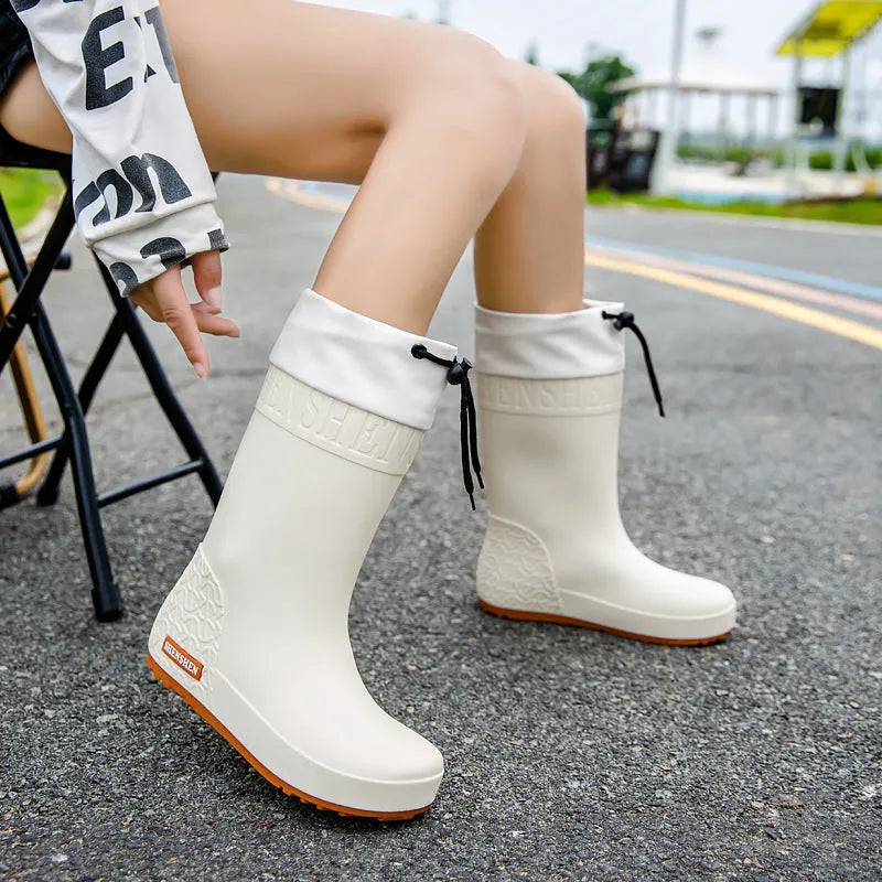 Women's PVC rain boots in apricot, black, brown and pink colours with non-slip wear-resistant construction
