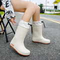 Women's PVC rain boots in apricot, black, brown and pink colours with non-slip wear-resistant construction