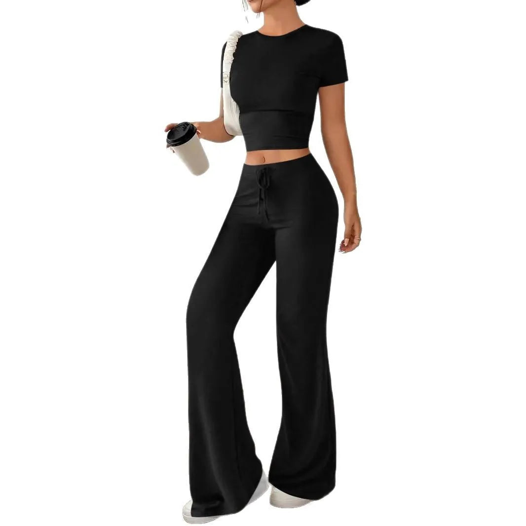 Black high waist trousers and short sleeve t-shirt women's co-ord set on a hanger.