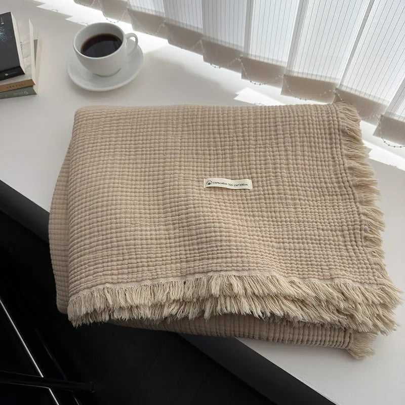 Four-layer gauze cotton blanket with tassel trim in navy blue colour