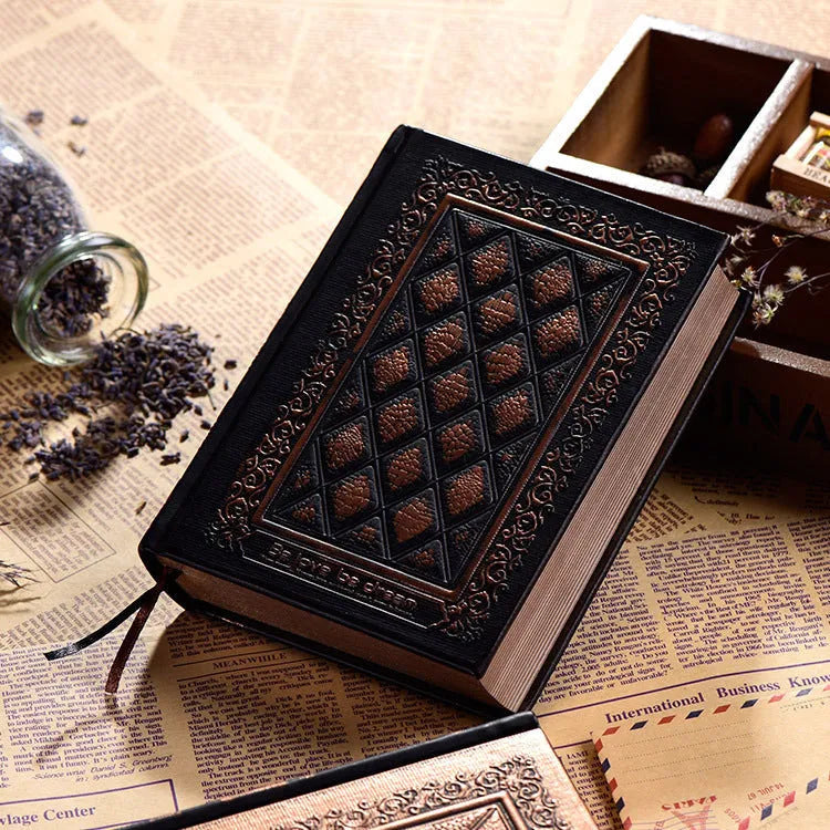 Embossed faux leather notebook with three-dimensional patterns in bronze or black gold colour