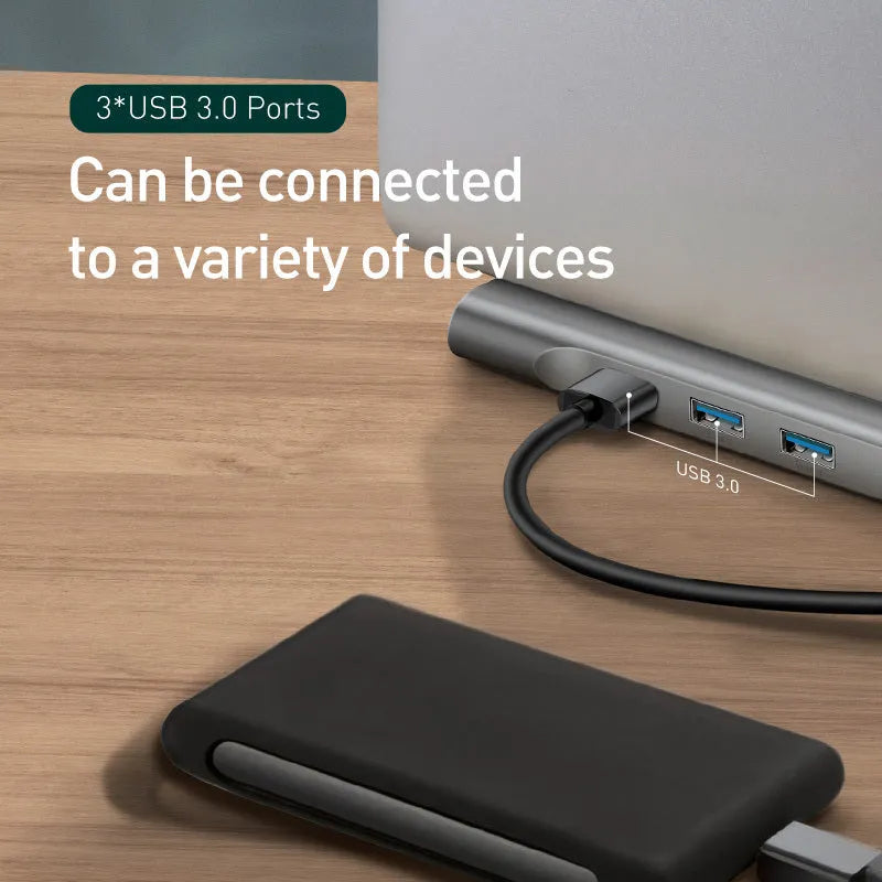 Ten-port USB C hub docking station with aluminium cooling bracket showing HDMI, VGA, and network ports