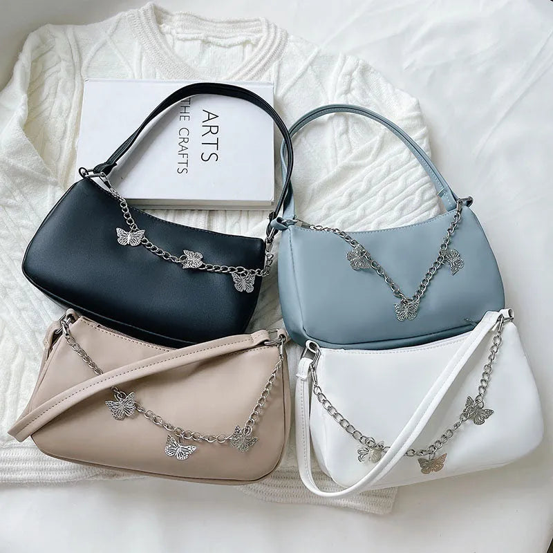 PU leather retro chain underarm bag in horizontal square shape showing crossbody strap and organised interior.