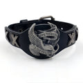 Black geometric leather bracelet with an eagle watch-button, showing tapered width.