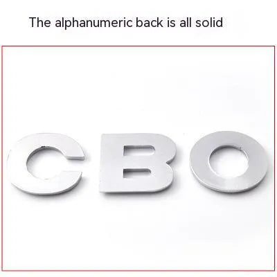 3D metal zinc alloy car letter sticker showing raised silver letter on clear adhesive backing.
