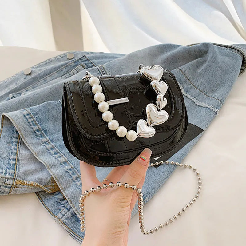 Silver PU leather mini tote saddle crossbody bag for women with a single strap.