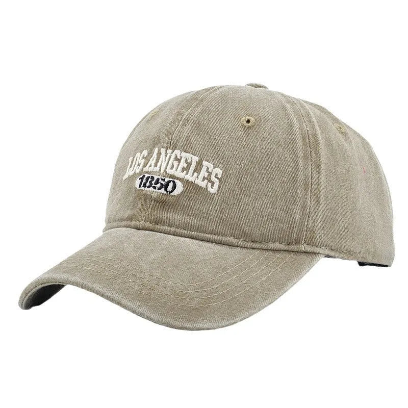 Personalised embroidered retro-style peaked cap in distressed beige with adjustable strap