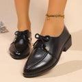 Women's British-style leather shoes with decorative bow detailing on pointed toe