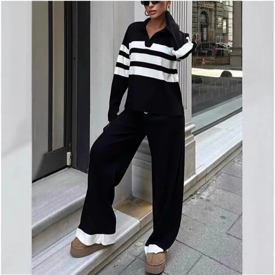 Women's black and white striped knitted two-piece set with polo collar and matching trousers