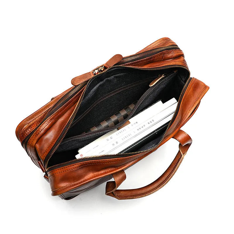 Large vintage leather men's briefcase with internal computer and camera pockets measuring 42cm wide