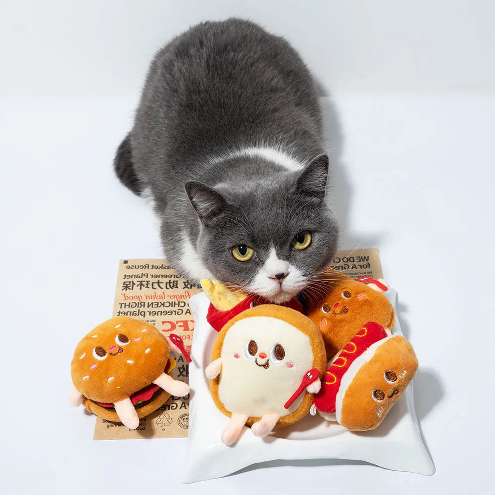 Set of five soft cat chewing toys shaped like bread, chicken legs, fries, a hamburger, and a hot dog.