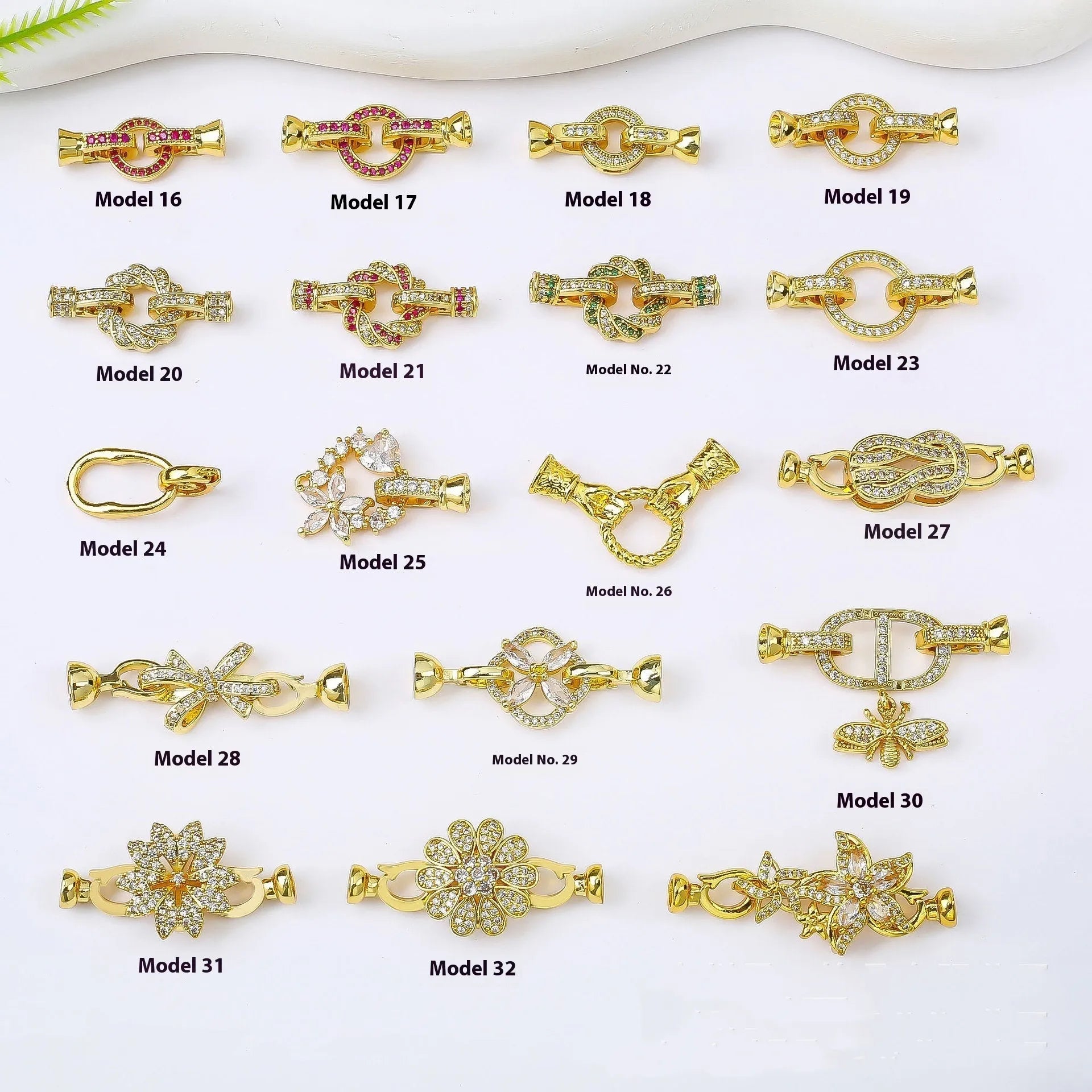 Small gold colour metal chain buckle for DIY necklace making on a white background.