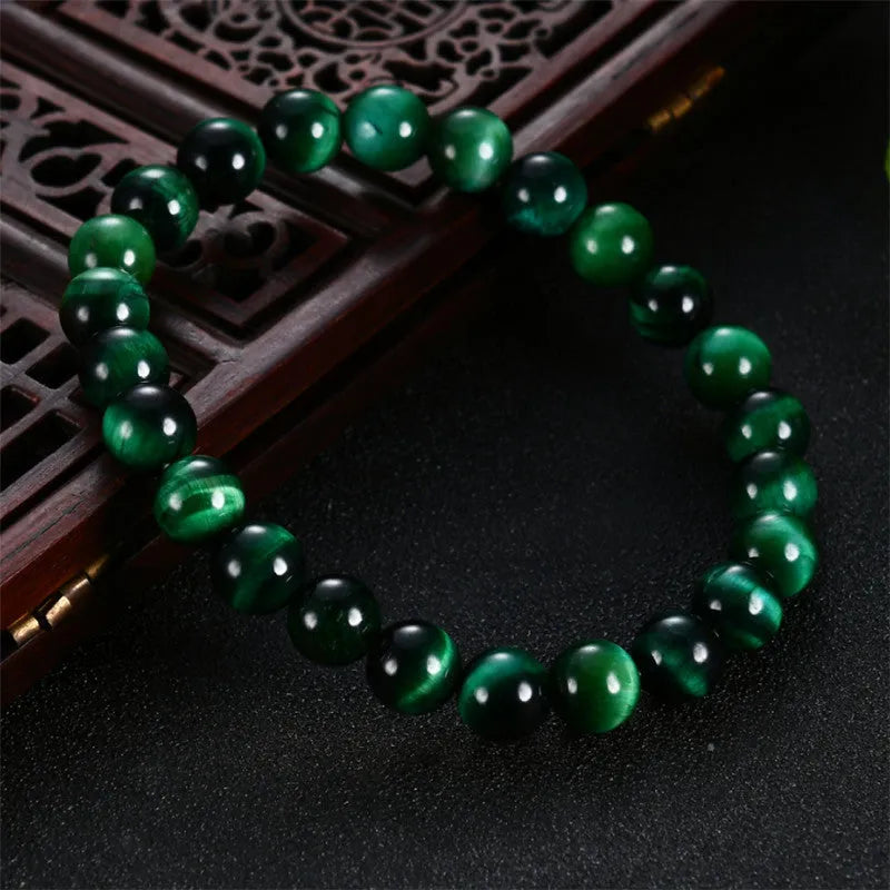 Natural green tiger eye stone bracelet with geometric polished beads in various sizes