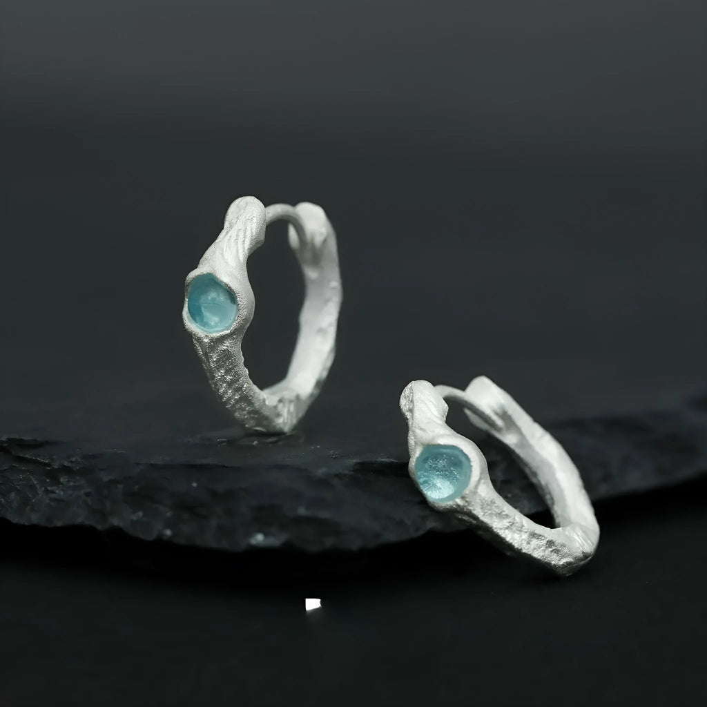 Geometric round ear clip in burnt silver tone, made from 925 silver with a clip-on back.