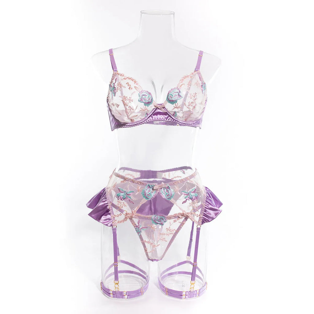 Light purple satin lingerie four-piece set with mercerized embroidery detailing, shown in both colour options