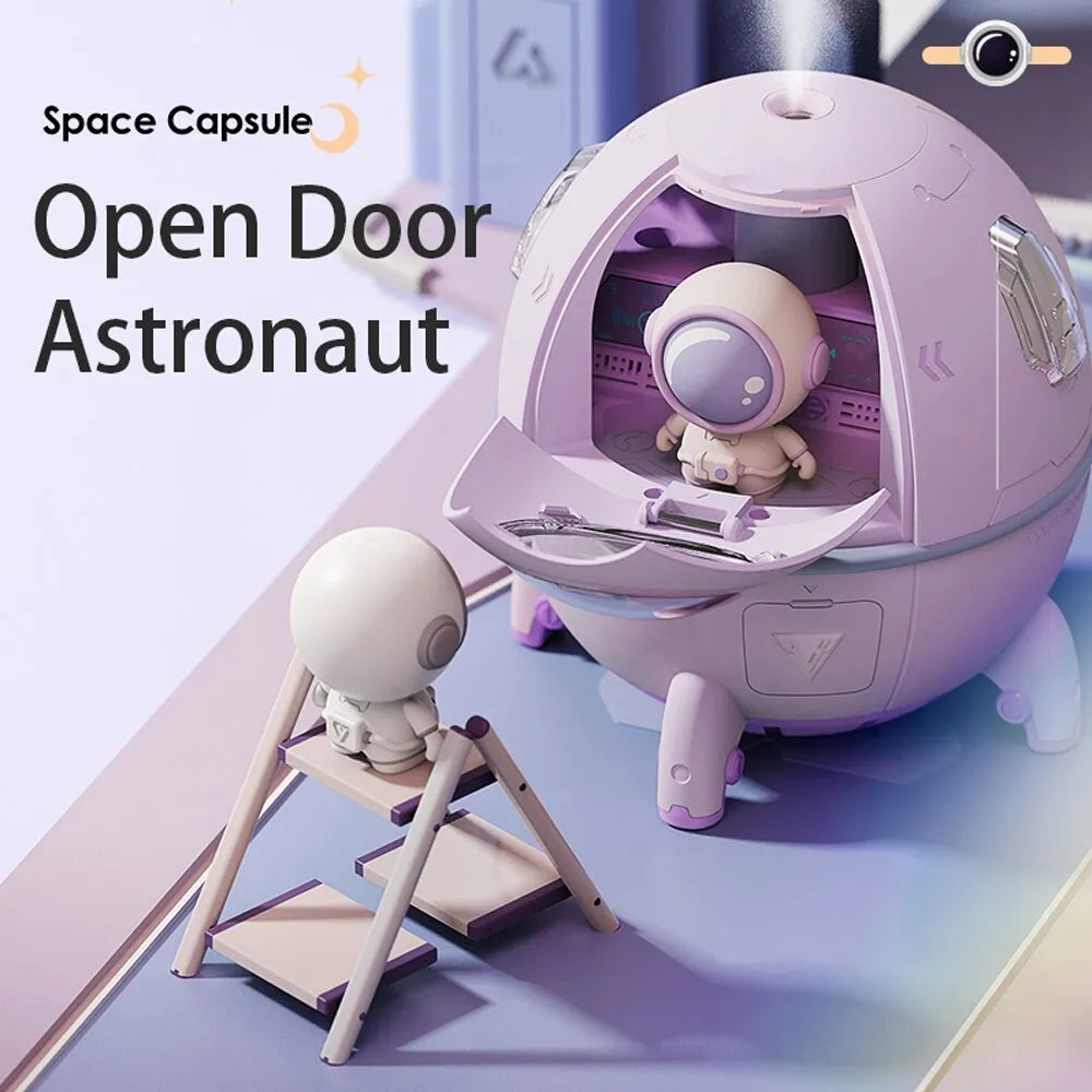 Purple astronaut-shaped USB portable humidifier with LED light on desk