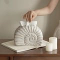 A modern conch ramble coloured resin tissue box for home or office desk organisation.
