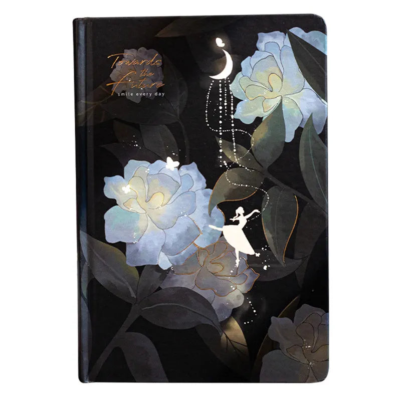 A5 notebook with luminous purple cover open to show pages filled with colour illustrations.