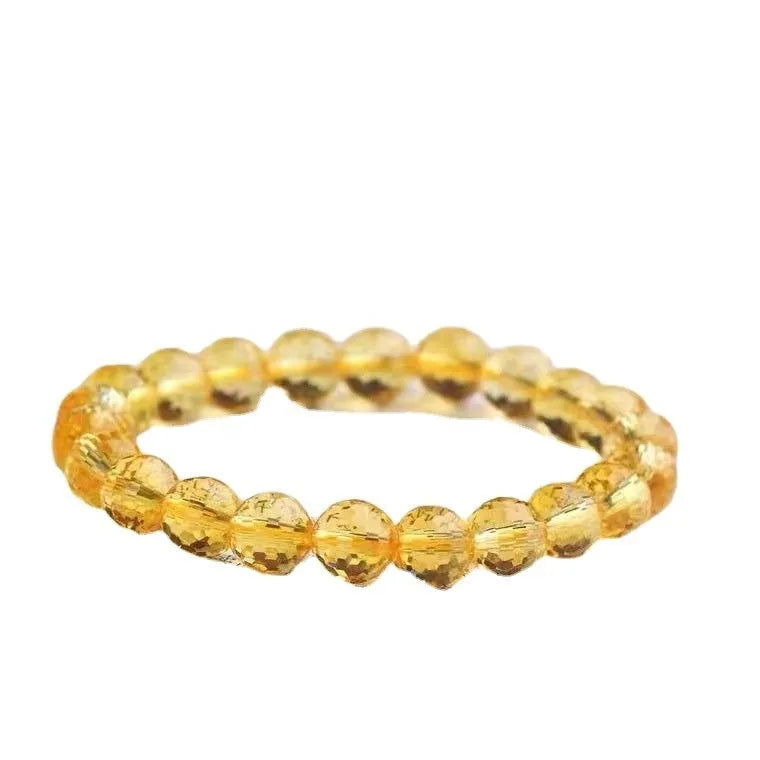 Handcrafted 128-facet crystal ametrine bracelet with detailed beads on a wrist.