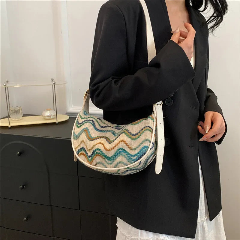 Women's straw woven crossbody bag with internal phone and file organisers in corrugated brown