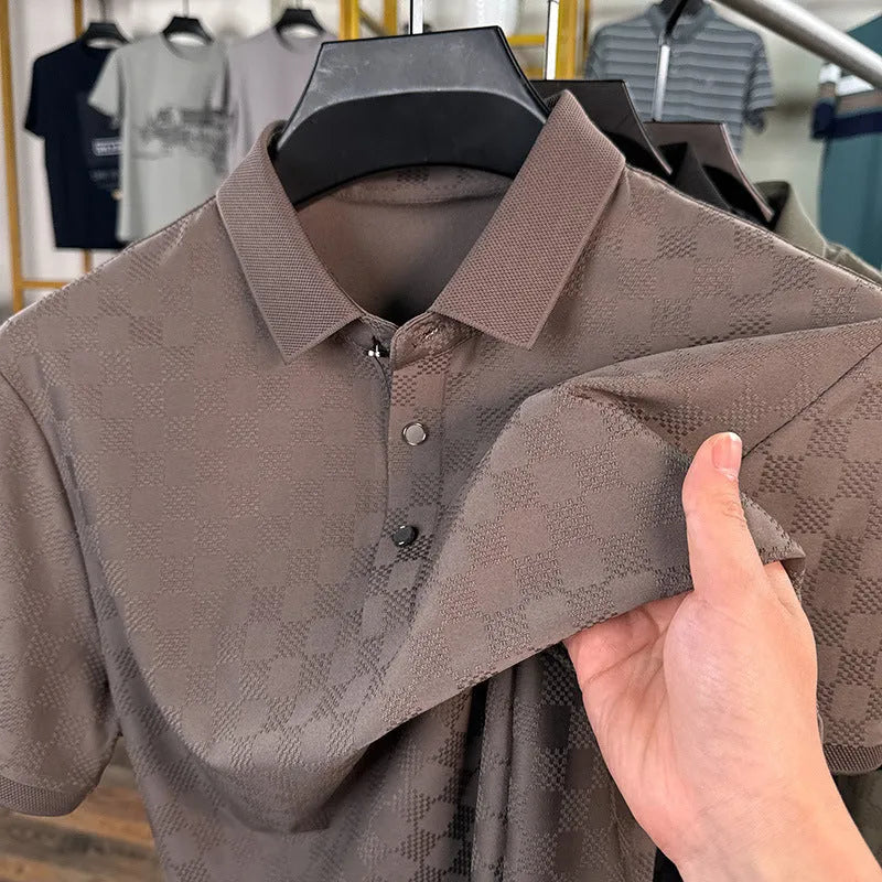 Thin Ice Silk blend short sleeve T-shirt in black with a V-neck and slit hem detail on a hanger.