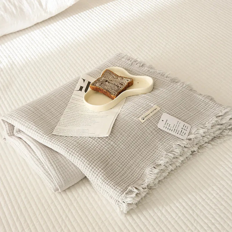 Four-layer gauze cotton blanket with tassel trim in navy blue colour